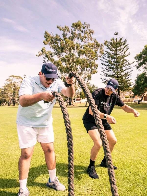 Ability Gym training a person with a disability using heavy ropes