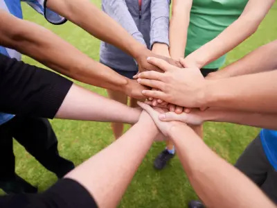 Ability Gym with their clients hands in a huddle